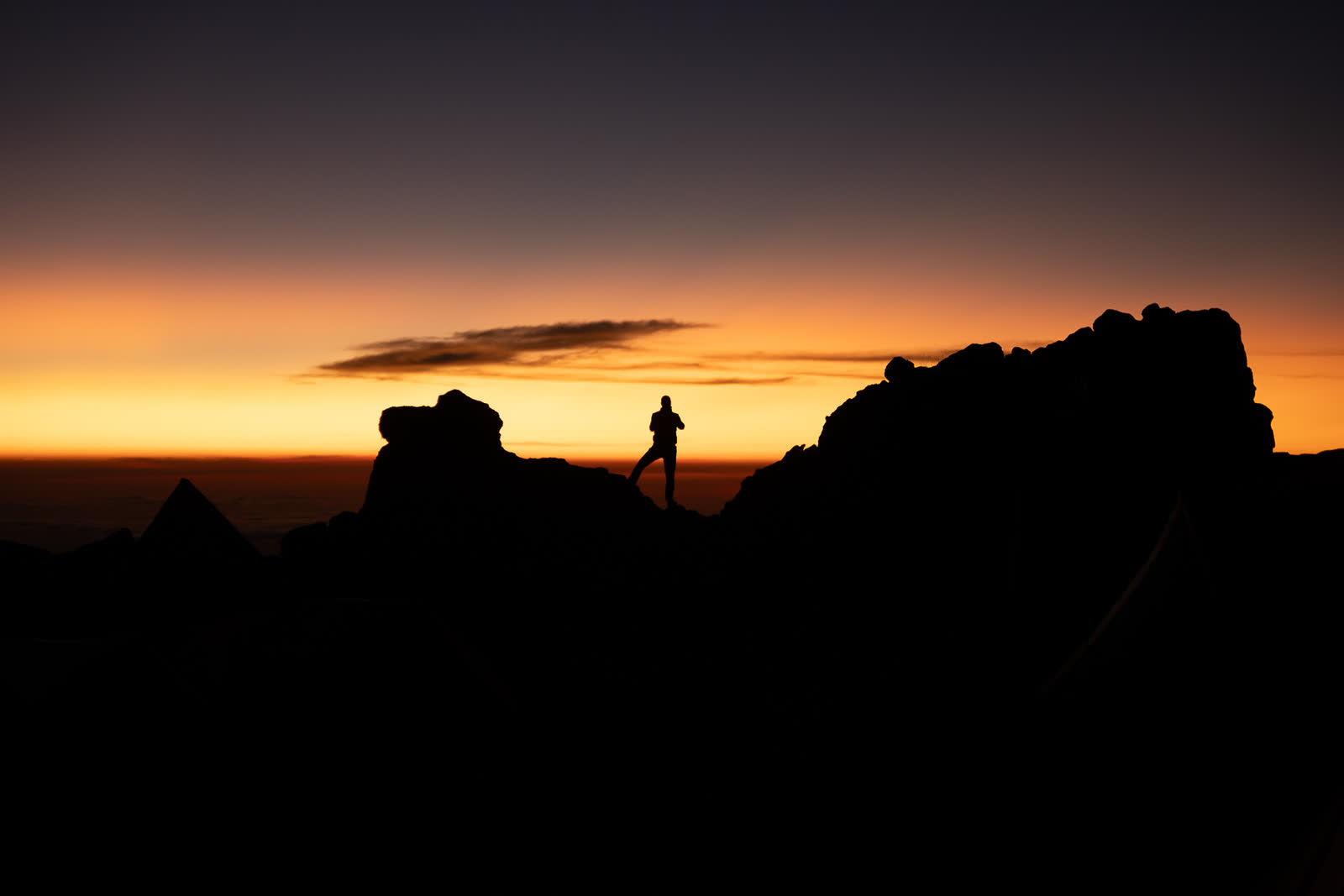Sunrise over a high mountain ridge.
